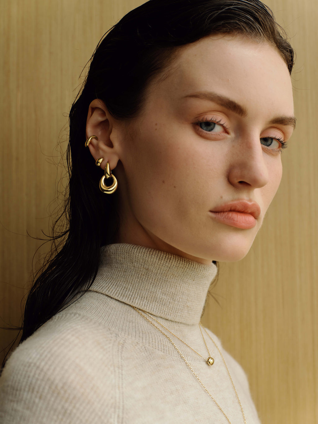 Gold Organic Dome Pebble Huggie Hoop Earrings – model view