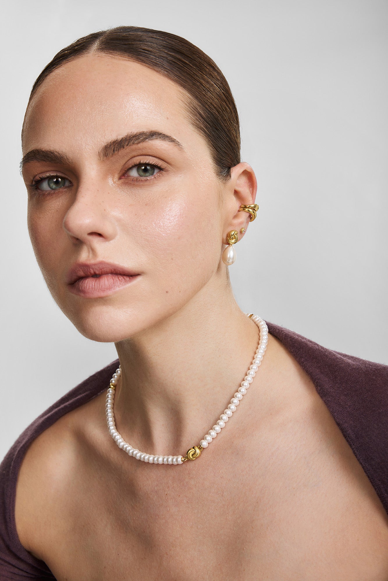 Gold Twist & Shell Pearl Drop Stud Earrings – model view