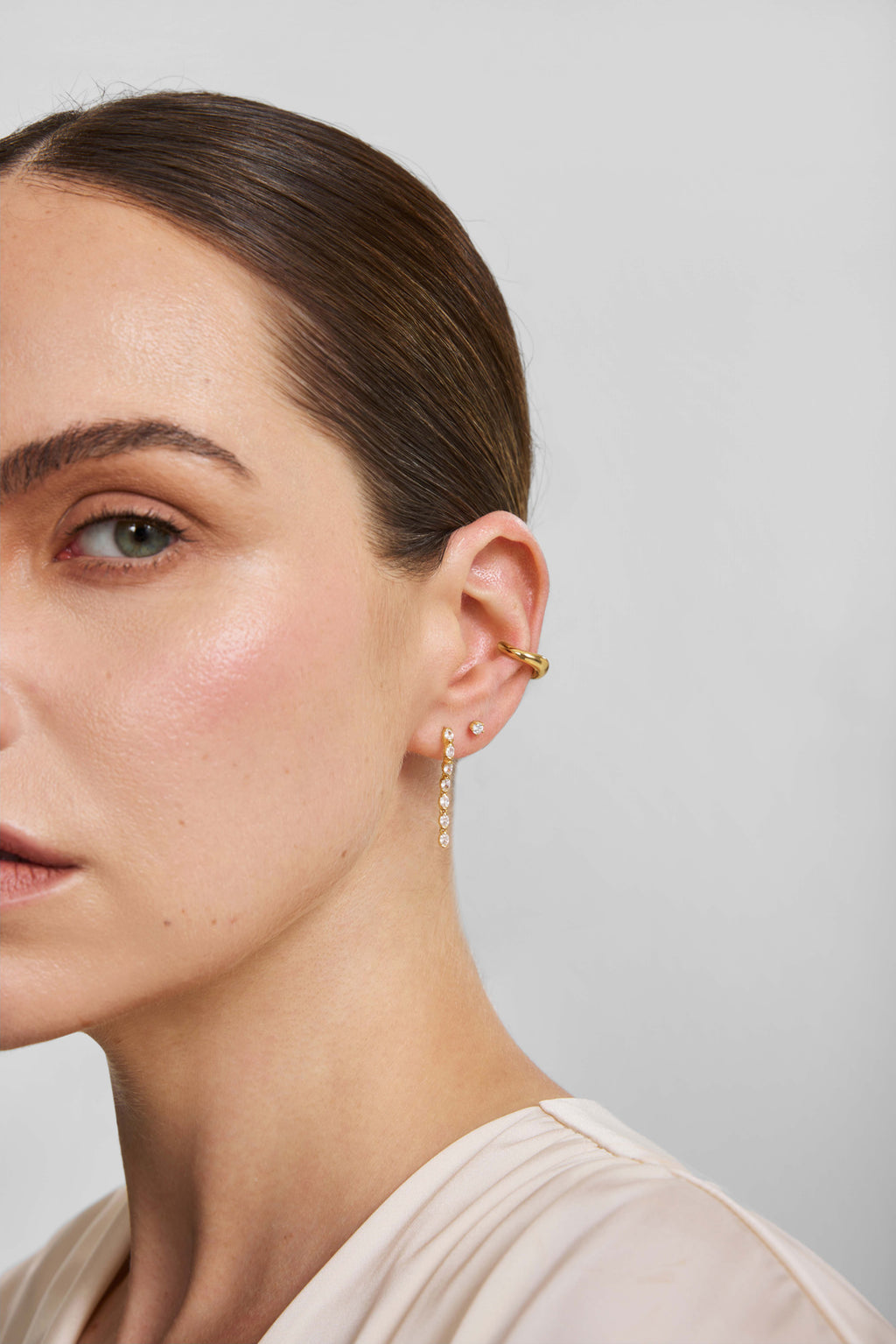 Gold Half-Bezel Oval Linear Dangle Stud Earrings – model view