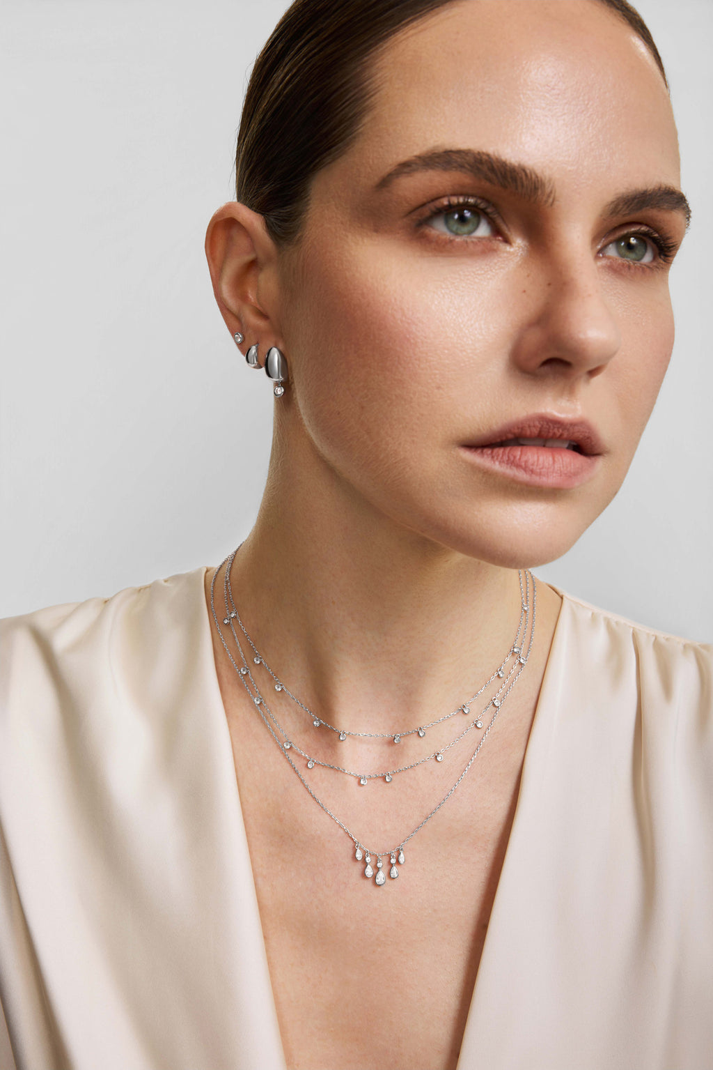 Silver Organic Dome Pebble Huggie Hoop Earrings – model view
