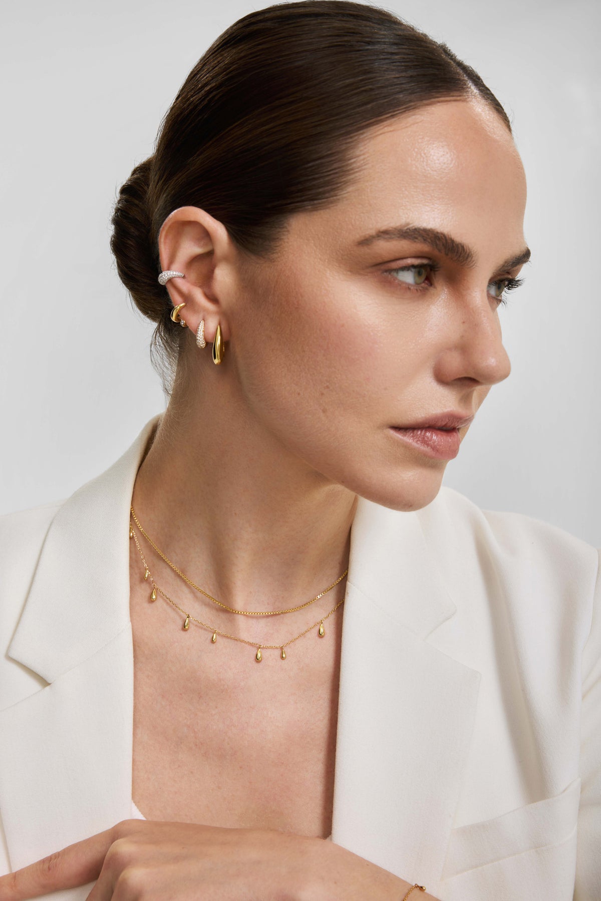 Gold Polished Teardrop Dangle Station Necklace – model view