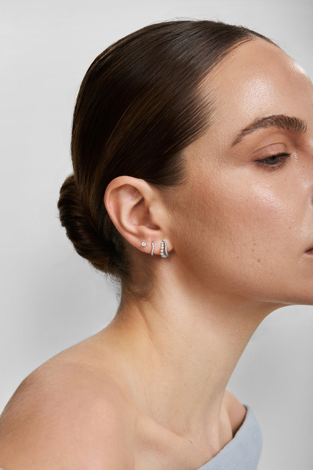 Silver Slim Pavé Wave Huggie Hoop Earrings – model view