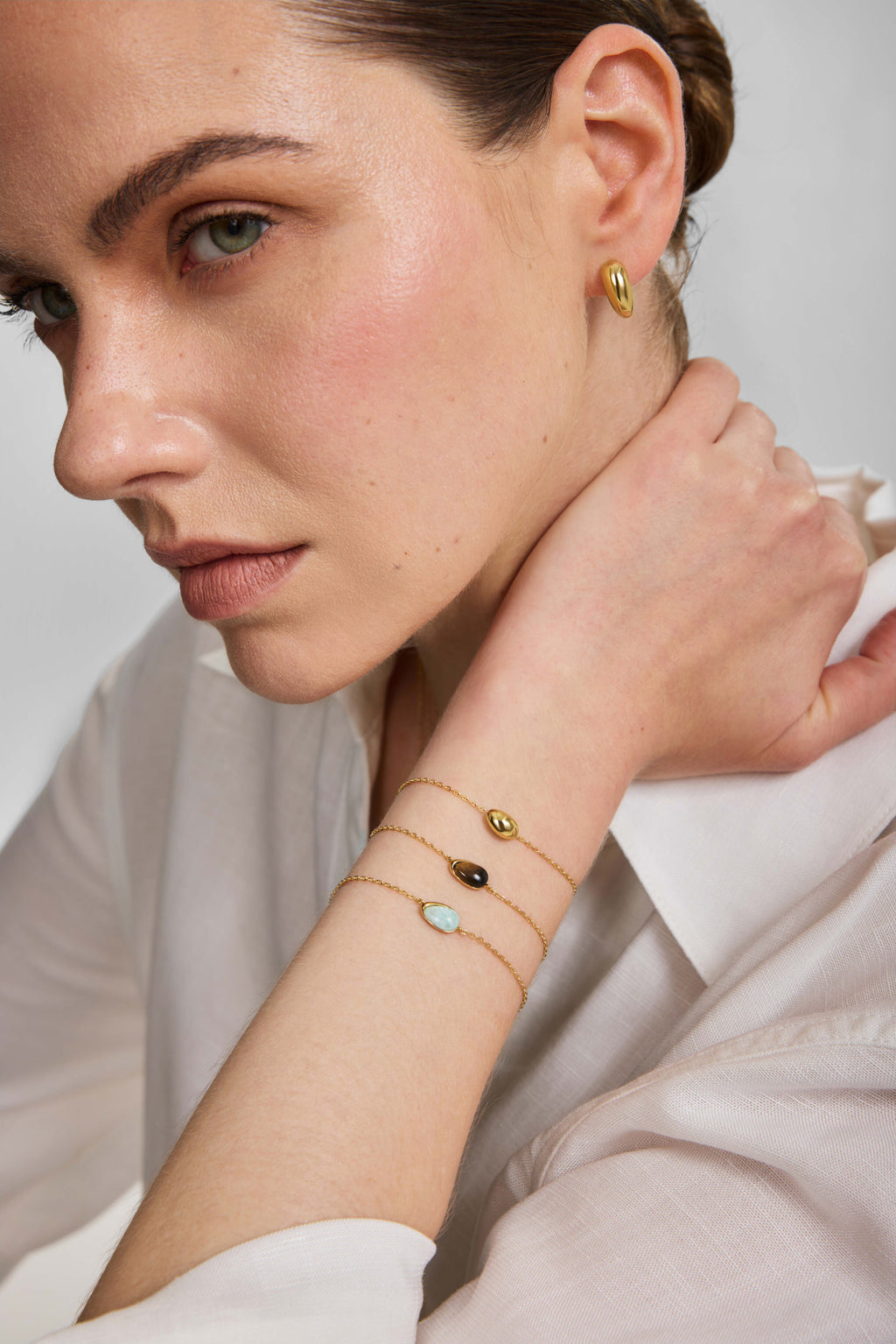 Gold Organic Dome Pebble Huggie Hoop Earrings – model view