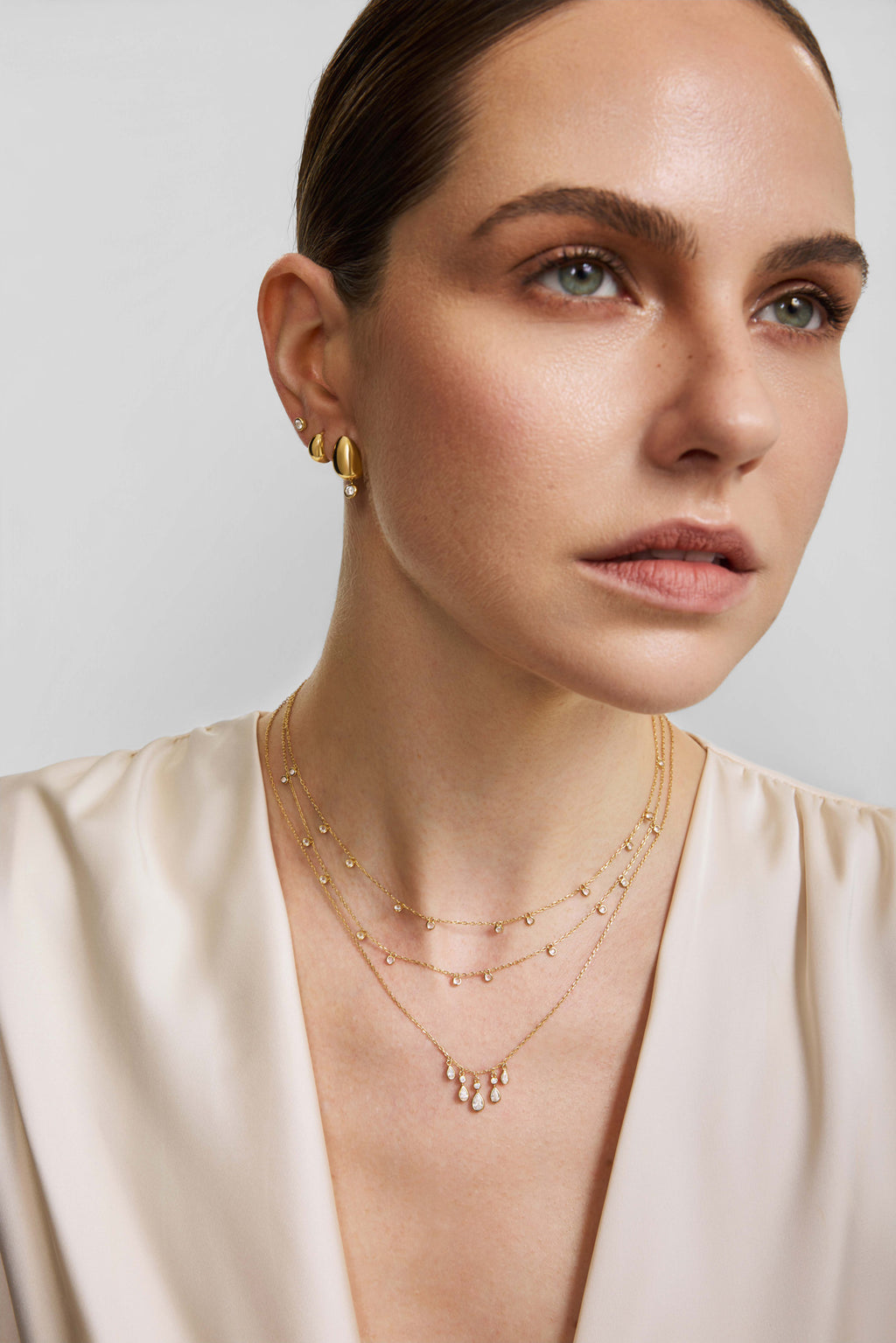 Gold Organic Dome Pebble Huggie Hoop Earrings – model view
